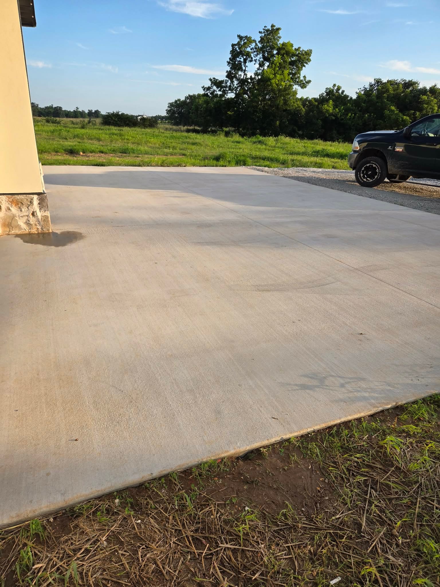 Pressure washing — concrete pad and driveway